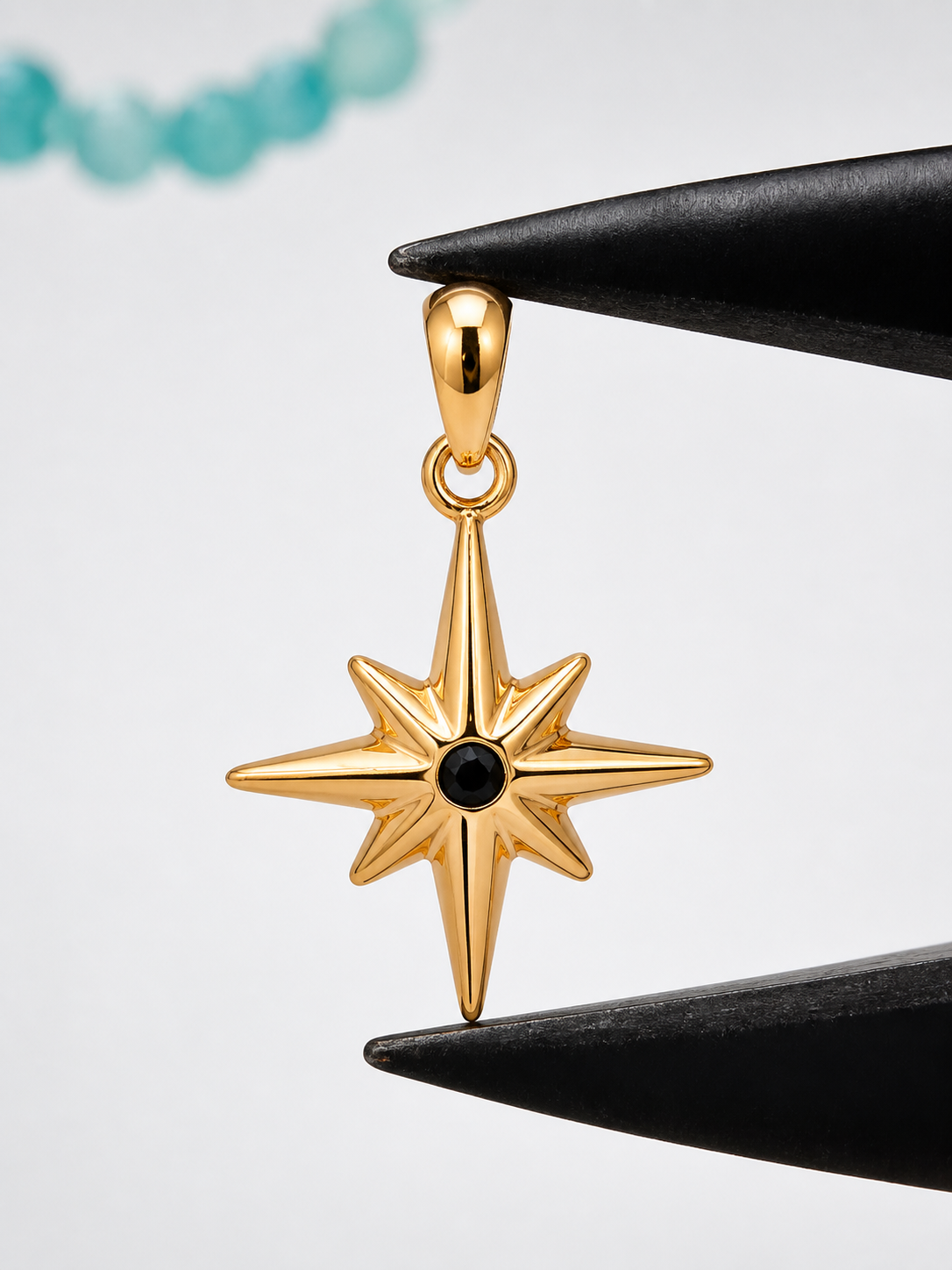 Close view of a Gemverie jewelry detail held between precision tools